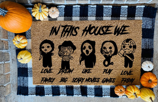 In This House We Love Family Dream Big Like Scary Movies Play Games Love Friday Door Mat in Black